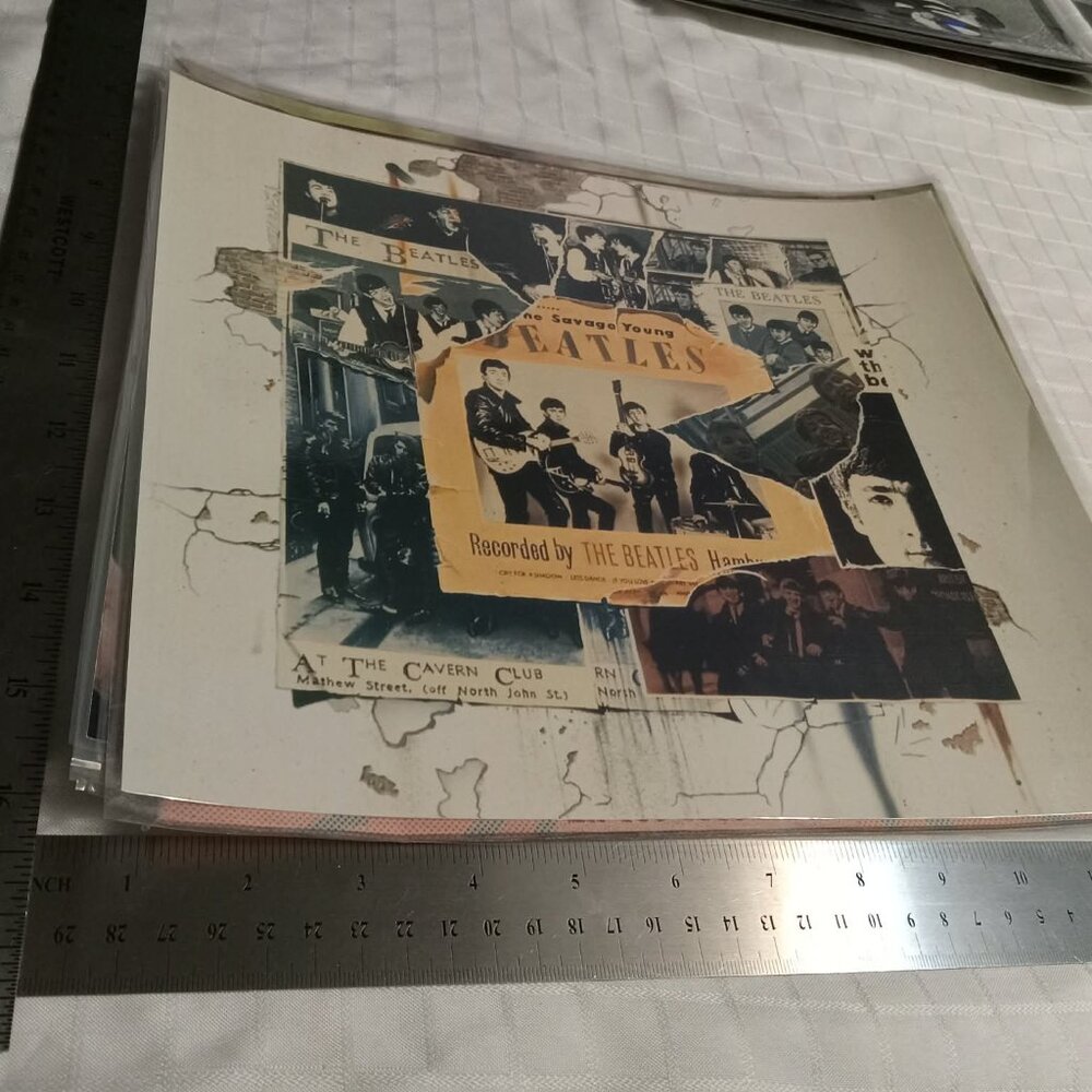 No1 : Ten laminated in plastic posters featuring the Beatles
